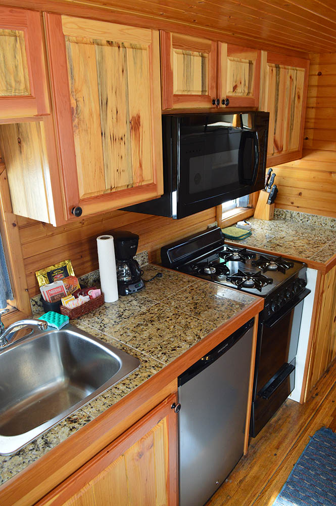 Kitchen in Orange caboose in Izaak Walton - Cabin Rentals in Glacier