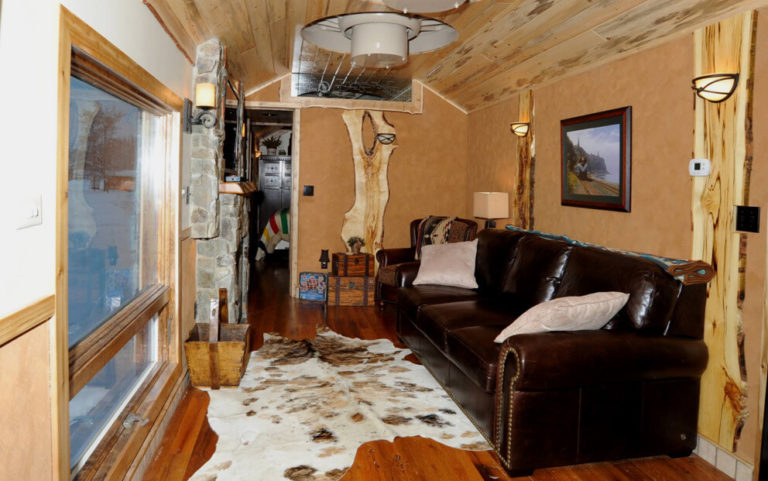 Living space in Railcar at Izaak Walton Inn - Luxury Cabins Near Glacier National Park
