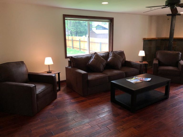 Cottage house living room seating area located at Izaak Walton Inn - vacation rentals Glacier National Park